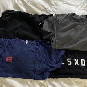 (4) size Men’s L gym shirts. No rips or tears. LSKD, Nike, Gymshark, Rogue.